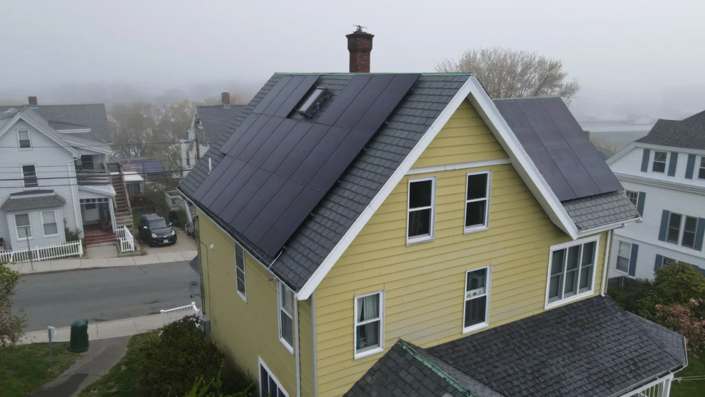 Aerial view of solar panels installed on a slate roof using the SlatePlate mounting system