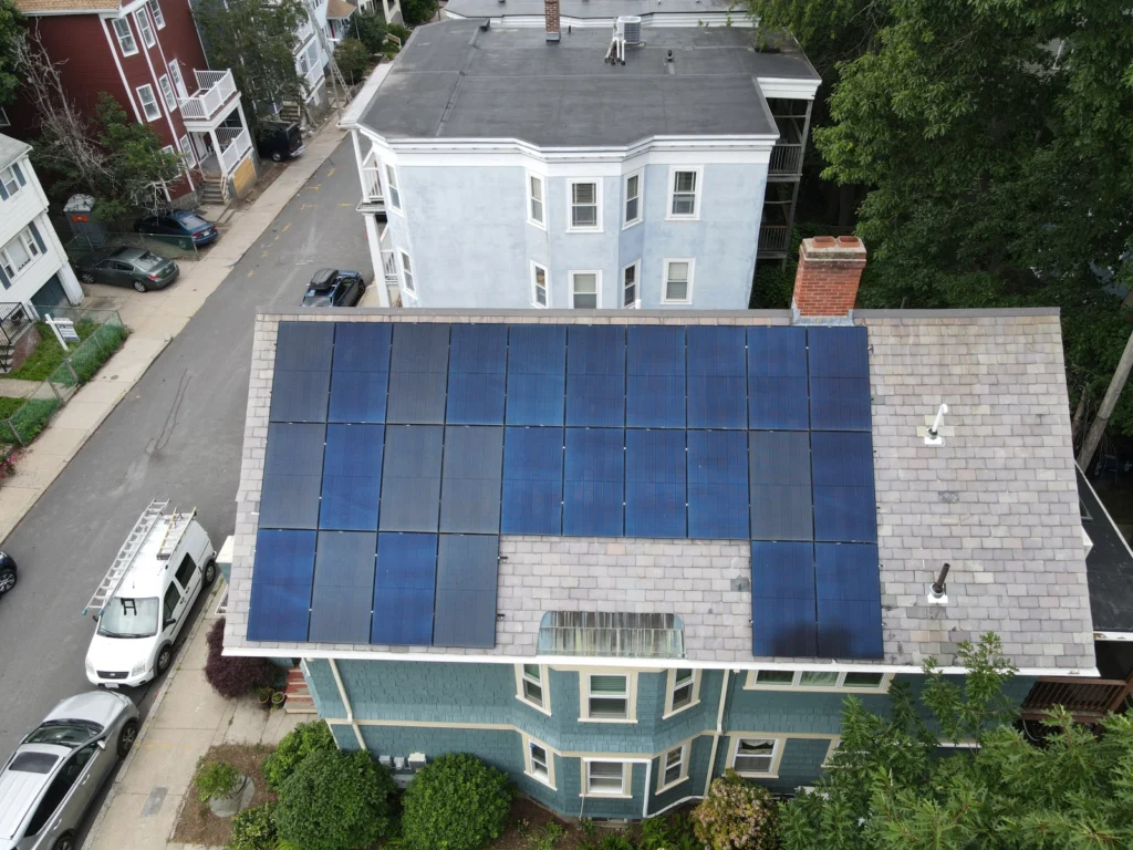 Aerial view of solar panels installed on a slate roof using the SlatePlate mounting system