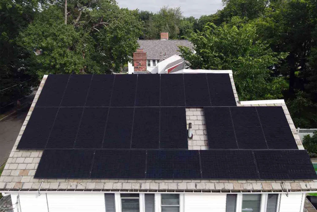 Solar panels mounted on a slate roof with the SlatePlate system, showing the finished installation