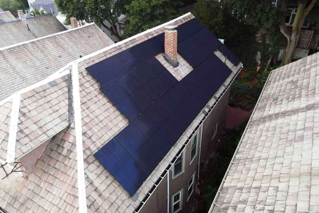 Solar panels mounted on a slate roof with the SlatePlate system, showing the finished installation